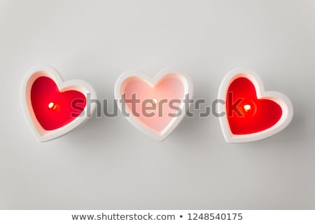 Foto stock: Burning Candles Heart Shaped