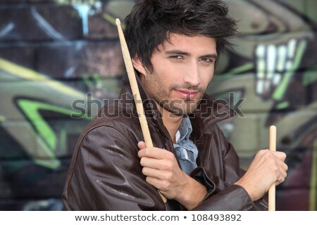 Stock fotó: Drummer Standing In Front Of Graffiti