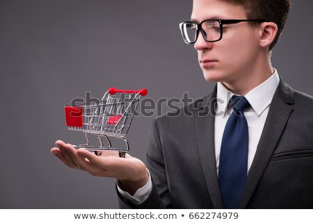 Shopping Cart On Palm Of Businessman And Goods Stock photo © Elnur