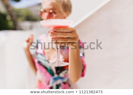 Foto stock: Beautiful Woman Drinking Cocktail Outdoors