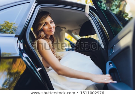 Stockfoto: Lovely Woman Posing And And Around A Vintage Car