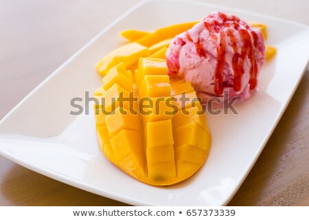 [[stock_photo]]: Mango Sorbet With Strawberry Sauce