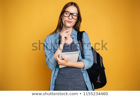 Foto d'archivio: Young Caucasian Female Hands Holding A Notebook And Writing Some