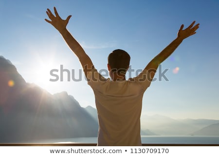 Stockfoto: Tourist Standing With Raised Arms Up