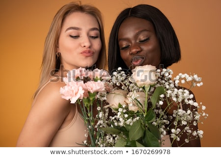 Stockfoto: Close Up Of Happy Lesbian Couple With Flowers