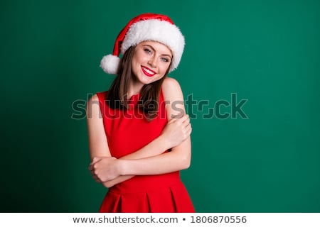 Foto stock: Happy Young Woman Holding A Mini Christmas Tree In Hands