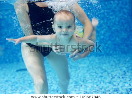 Foto stock: Mother With Baby Boy In Swimming Pool