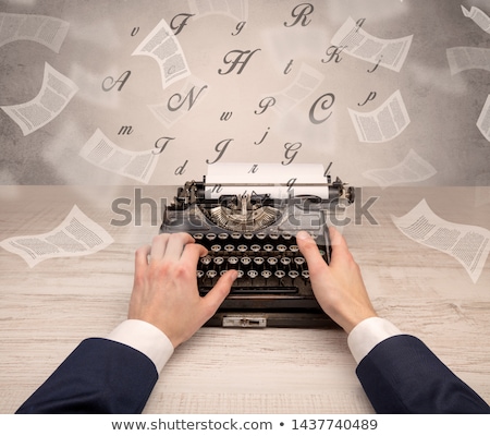 Stock photo: Hand Typewriting With Flying Documents Around