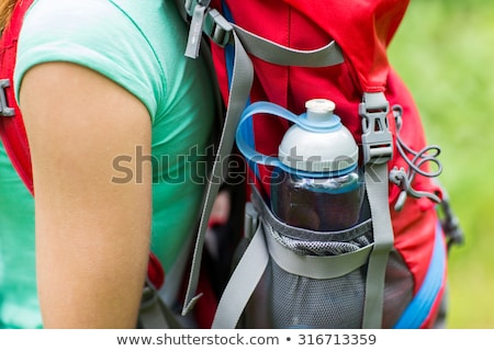 Zdjęcia stock: Close Up Of Woman With Water Bottle In Backpack