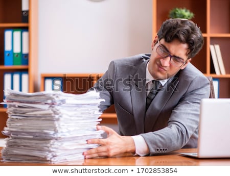 Foto stock: Young Handsome Employee Unhappy With Excessive Work