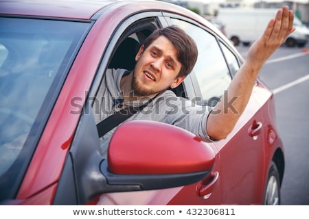 Stock fotó: Irritated Young Man Driving A Car Irritated Driver