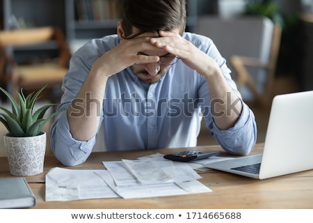 Foto stock: Young Male Working Analysis Finance With Calculate About Cost On