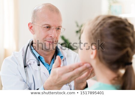 Сток-фото: Bald Pediatrician In Eyeglasses And Whitecoat Examining Little Patient Glands