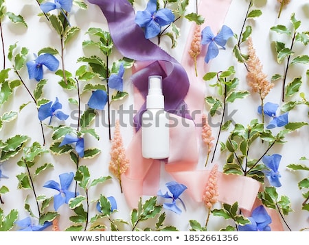 Foto d'archivio: Blank Label Cosmetic Container Bottle As Product Mockup On White Silk Background