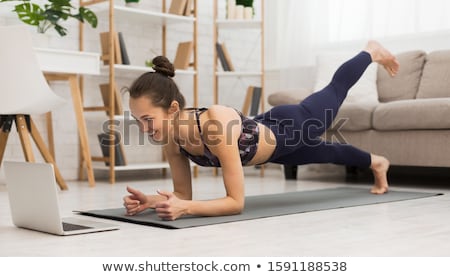Foto stock: Young Woman Doing Yoga
