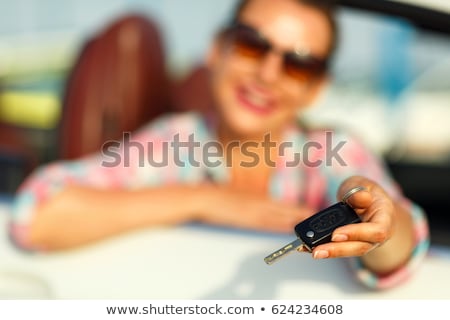 Stock fotó: Young Pretty Woman Sitting In A Convertible Car With The Keys In