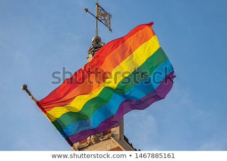 Foto d'archivio: Close Up Of Rainbow Gay Pride Flag Waving On Building