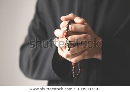 Foto stock: Young Priest With Rosary Beads