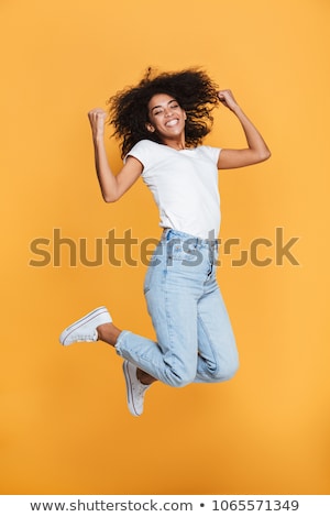 Stok fotoğraf: Full Length Portrait Of A Cheerful Young African Woman