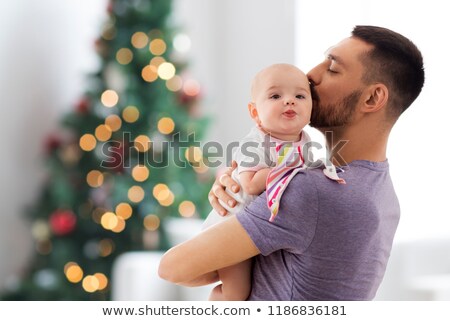 Zdjęcia stock: Father With Baby Daughter Over Christmas Tree