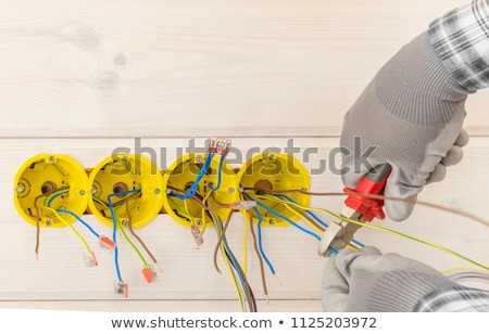 Stockfoto: Electrician Installing Socket In New House