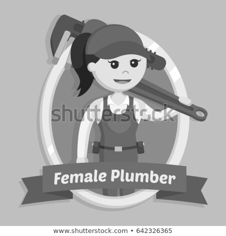 Stock photo: Female Plumber Holding Giant Spanner
