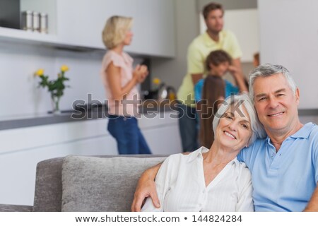 Stockfoto: Retired Couple Looking At Their Laptop At Home