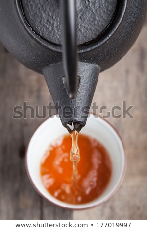 Stock fotó: Green Tea Being Poured Out Of A Japanese Teapot