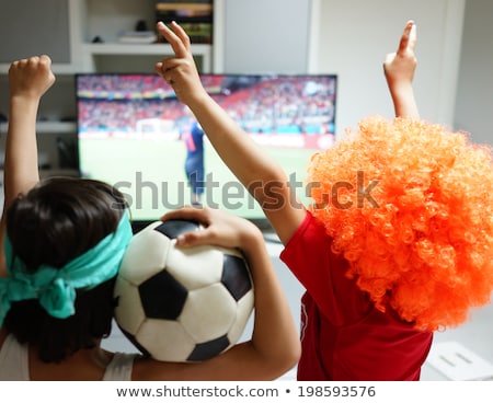 Stockfoto: Kids With Football Watching Soccer World Cup Game 2014 On Tv In