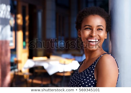 Сток-фото: Smiling Young Woman Standing Outdoors