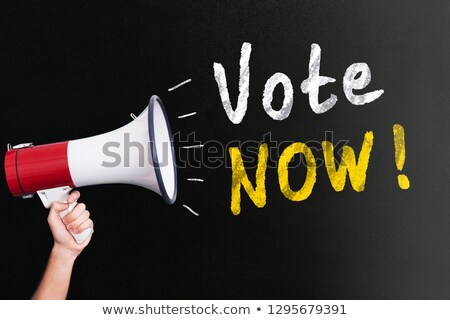 Stock photo: Human Hand Holding Megaphone Near Vote Now Text