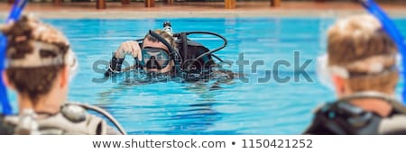 [[stock_photo]]: Diving Instructor And Students Instructor Teaches Students To Dive Banner Long Format