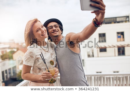 ストックフォト: Friends With Drinks Taking Selfie At Rooftop Party