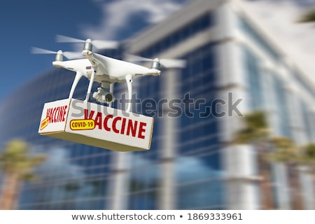 Foto stock: Unmanned Aircraft System Quadcopter Drone In The Air Near City A