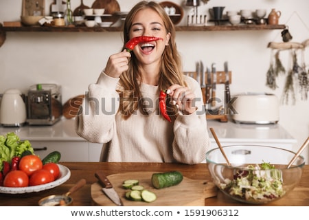 [[stock_photo]]: Image Of Cheerful Cute Woman Making Fun With Bell Pepper