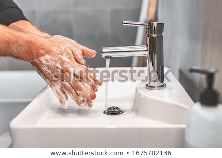 Washing Hands With Soap At Work Bathroom Sink Man Hand Care Hygiene For Coronavirus Outbreak Prevent Zdjęcia stock © Maridav