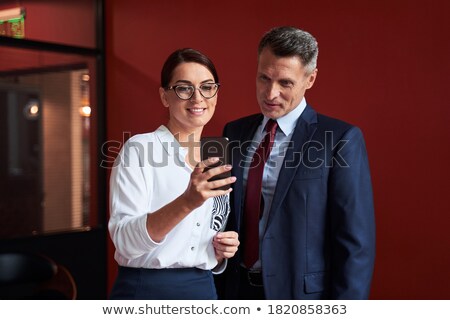 ストックフォト: A Teamleader Talking To His Colleagues In An Office