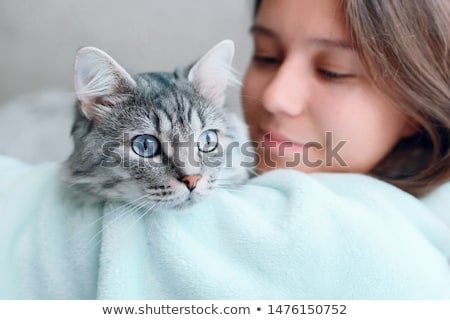 [[stock_photo]]: Pretty Young Woman With Her Cat