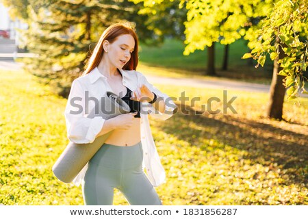 Сток-фото: Pretty Athletic Redhead Stretching In Park