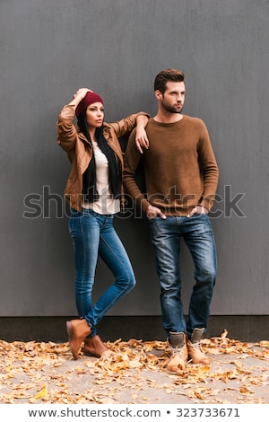 Stok fotoğraf: Young Elegant Fashion Couple Looking Away