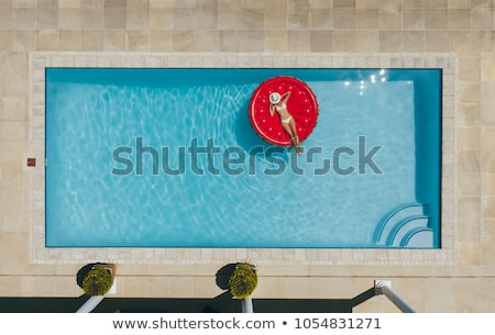 Stockfoto: Aerial View Of Inflatable Mattress In Swimming Pool