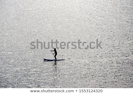 Stock fotó: Swimmers Standing In Row On Beach