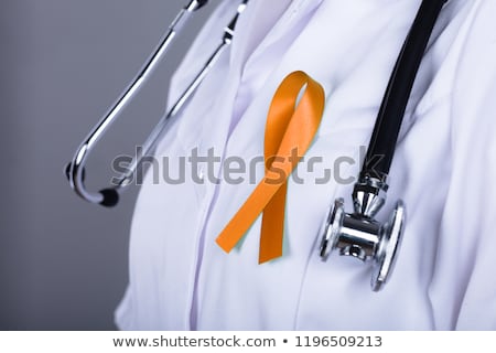 Stockfoto: Gynecologist With Uterine Cancer Awareness Ribbon