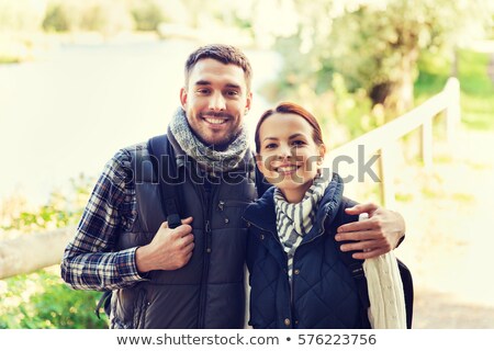 Foto d'archivio: Happy Couple Hugging At Camp In Woods