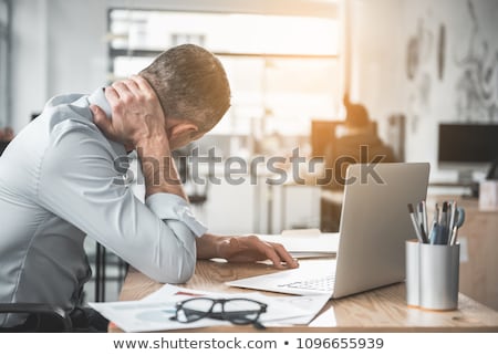 Zdjęcia stock: Young Injured Male Employee Working In The Office