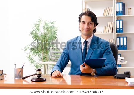 Stok fotoğraf: Young Handsome Judge Sitting In Courtroom