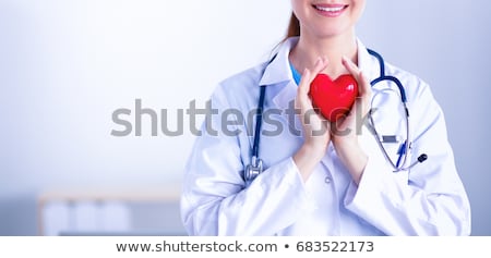 Foto stock: Beautiful Smiling Woman Holding Red Heart