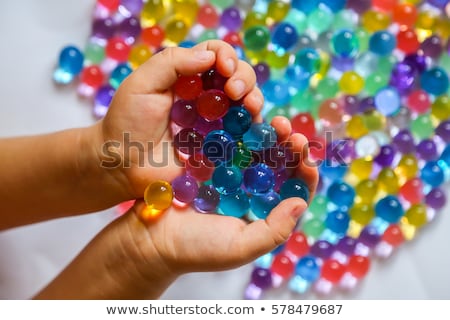 Zdjęcia stock: Colored Balls Of Water Beads Hydrogel In In Hands Sensory Experiences