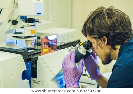 Stock fotó: Scientist Work On A Confocal Scanning Microscope In A Laboratory For Biological Samples Investigatio