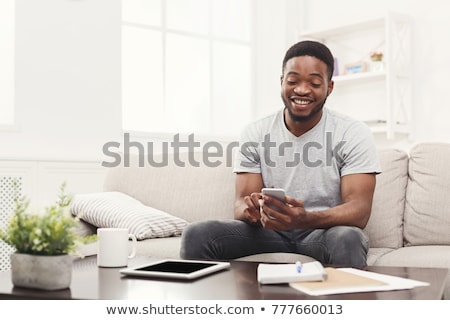 Сток-фото: African American With Laptop In Livingroom